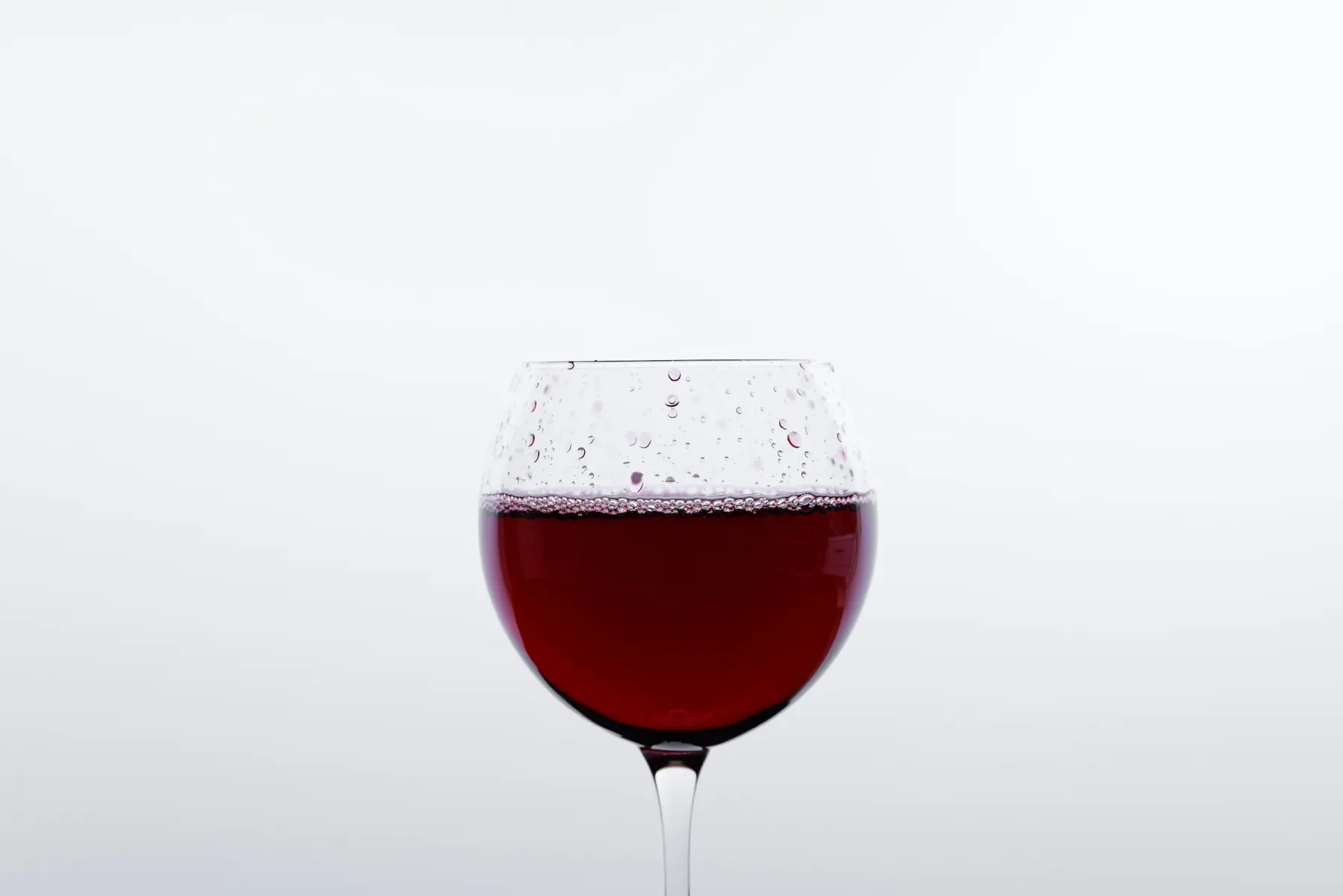 Glasses of red wine in soft light